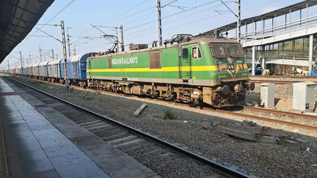 Indian Railways goods train at a station platform